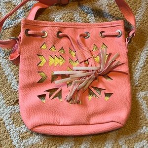 Cute, coral, children’s purse with gold and tassels